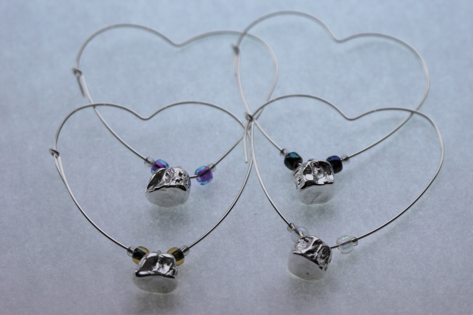 Tucho Offerings - LOVE, Sterling Silver Whitefish Vertebrae Heart Hoop Earrings