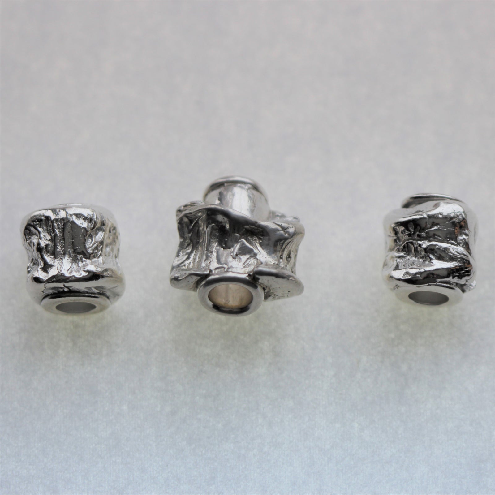 Tucho Offerings - MEMORIES, Sterling Silver Jackfish Vertebrae Charm Bracelet Barrel Bead